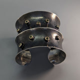 Sterling Silver Wide Anti-Clastic Bracelet with Green  Diamonds in 14kt Gold Bezels