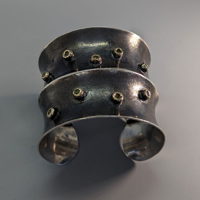 Sterling Silver Wide Anti-Clastic Bracelet with Green  Diamonds in 14kt Gold Bezels