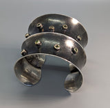 Sterling Silver Wide Anti-Clastic Bracelet with Green  Diamonds in 14kt Gold Bezels